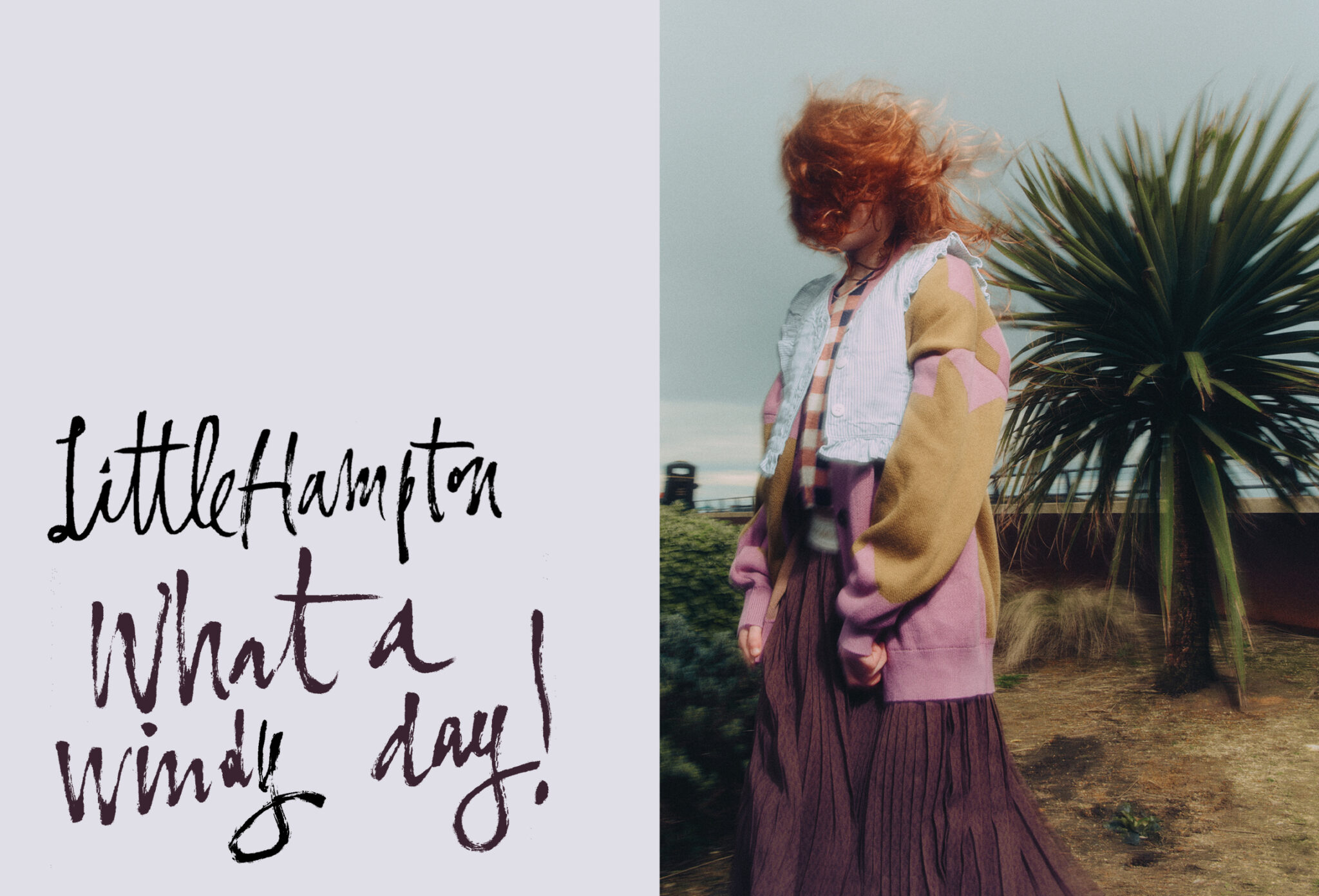 girl in front of a palmtree on a windy day in littlehampton