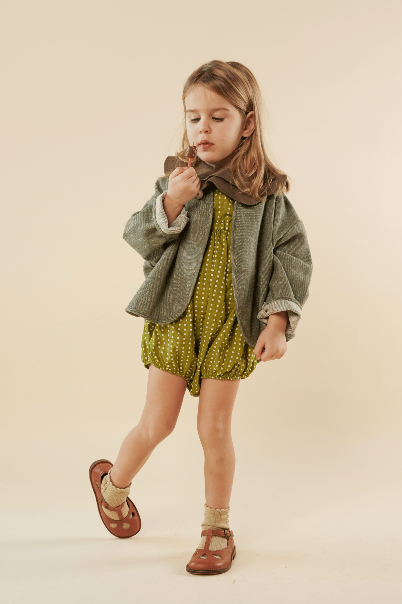 girl eating a chocolate cone in a fashion editorial