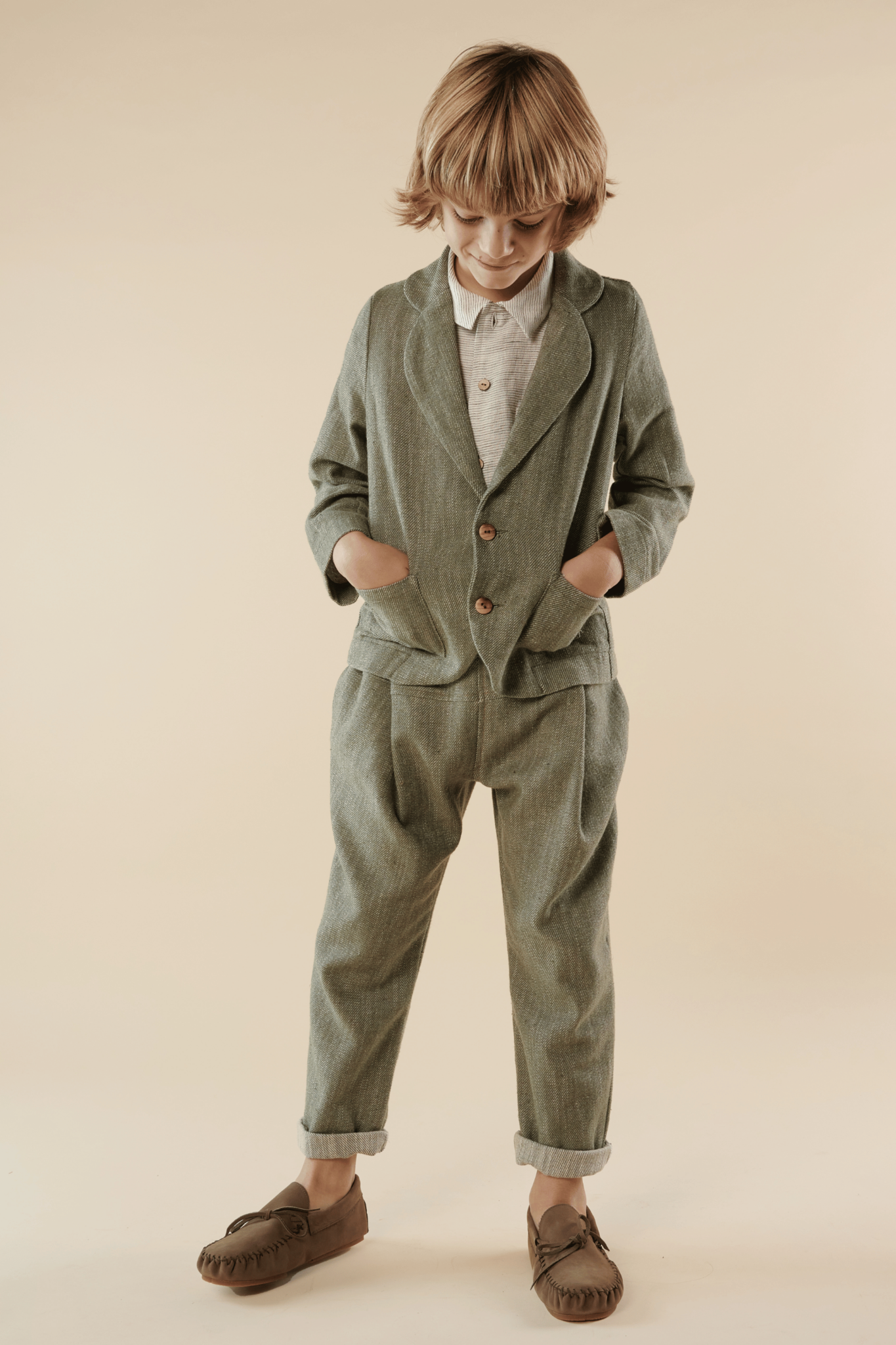 boy dressed in blazer and pants made of linen