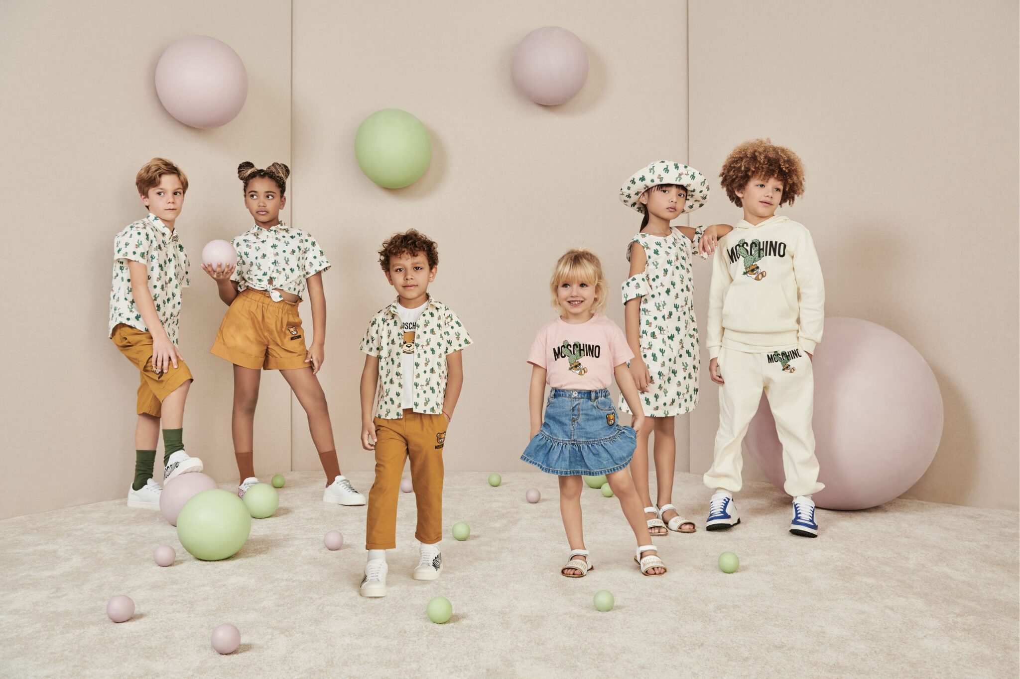 boys and girls dressed in Moschino outfits with logo, fashion kids