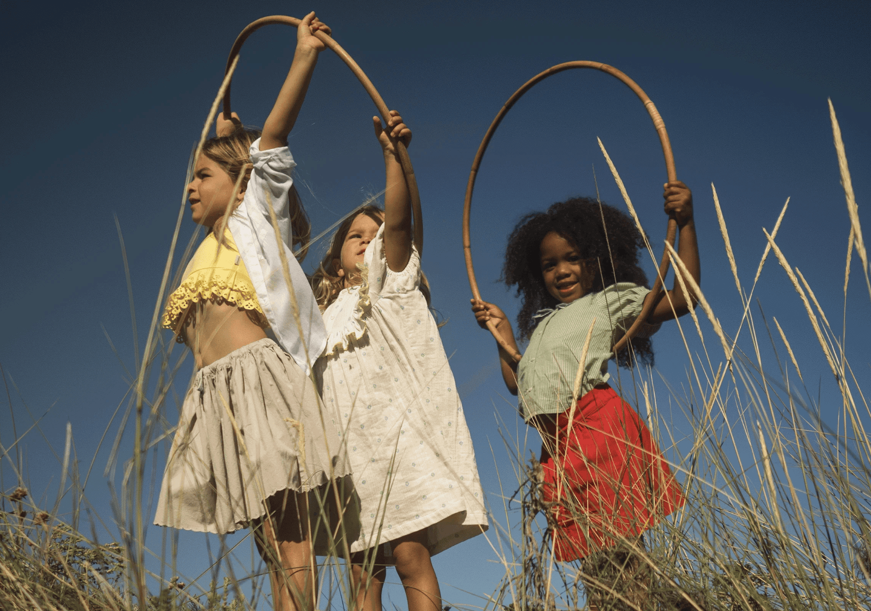 girls playing in a summer field