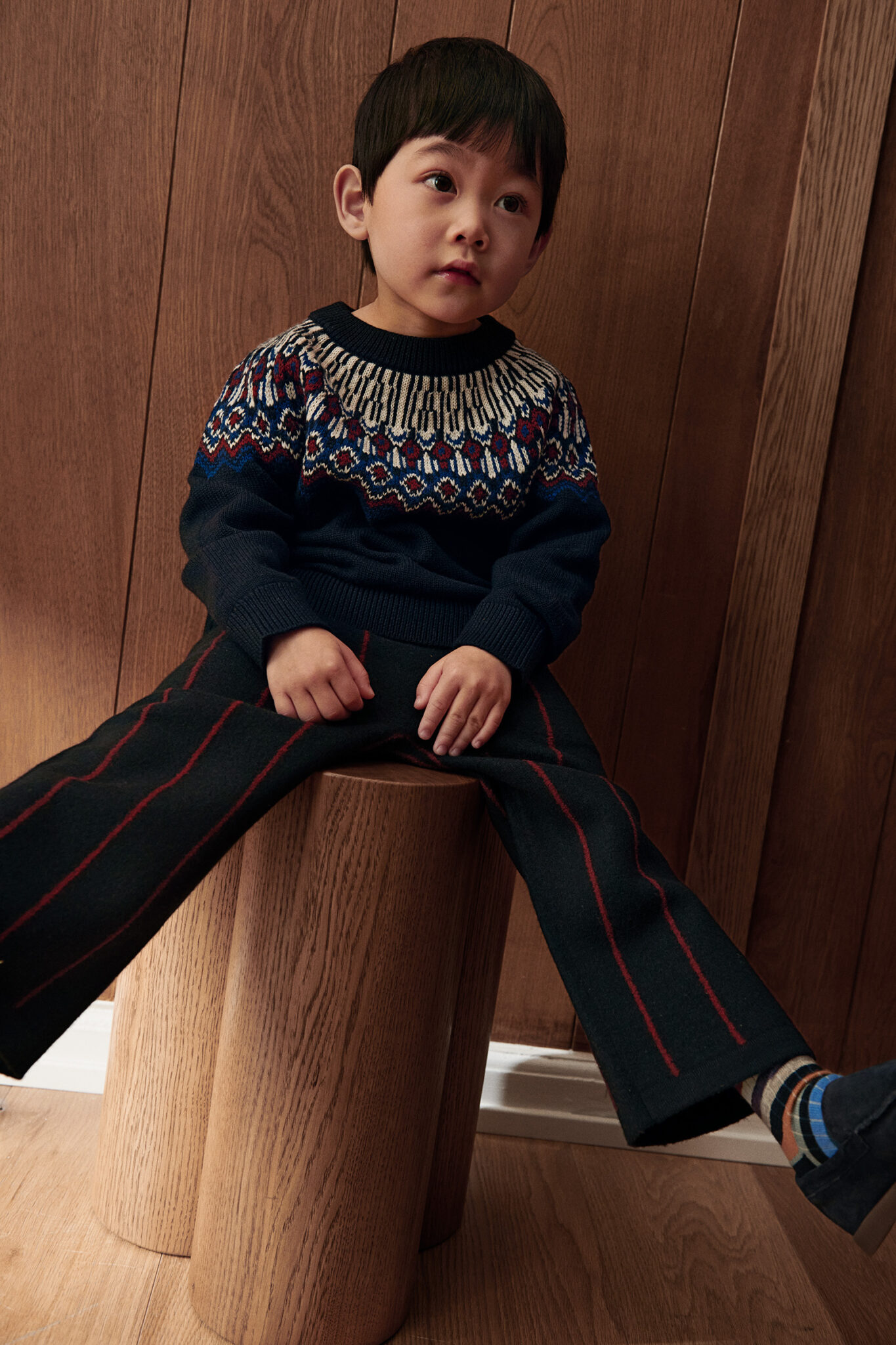 asiatic kid wearing knitwear