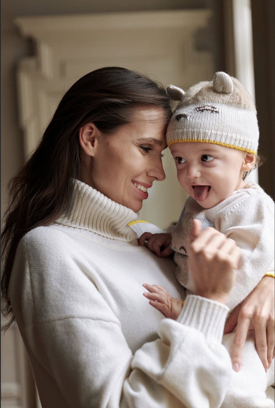 smiling mom with baby