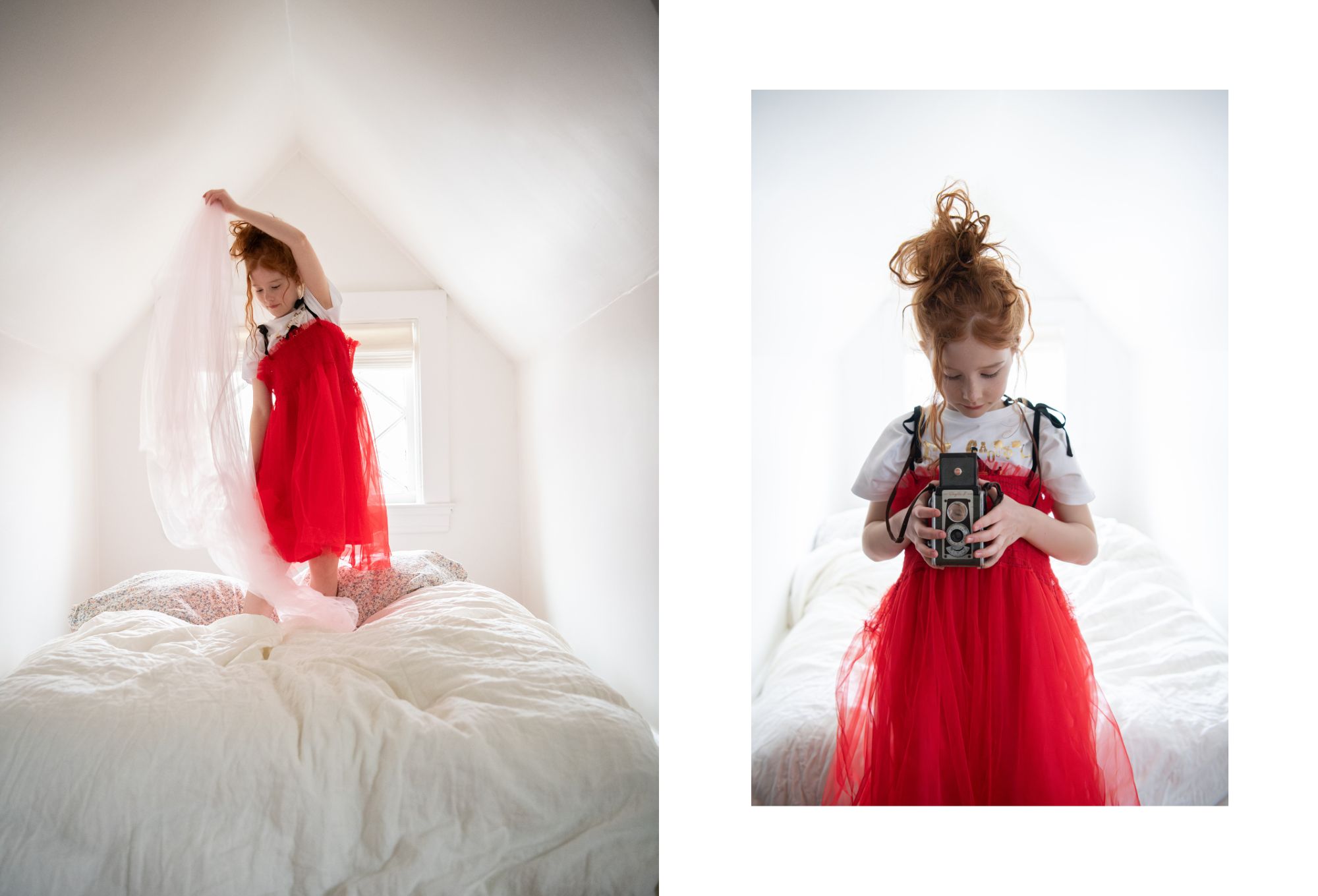 In a bright white attic bedroom, a young girl with red hair stands on a bed wearing a vibrant red tulle dress over a printed T-shirt. In the left image, she lifts a sheer white fabric above her head as it flows dramatically around her. In the right image, she looks down intently at a vintage twin-lens reflex camera she holds in both hands. The soft light and dreamy atmosphere evoke a sense of play and imagination. Photo by Sabrina Helas.