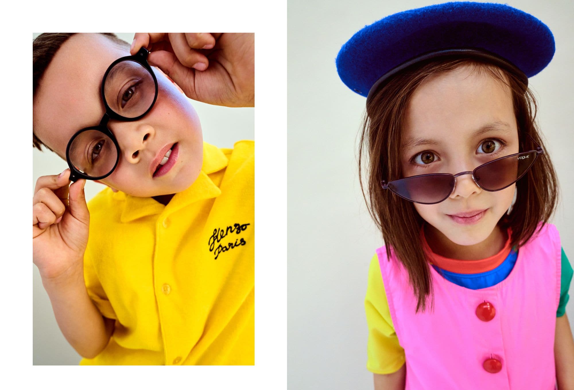 Ritratto ravvicinato di due bambini. A sinistra, un bambino con occhiali rotondi neri e camicia gialla con la scritta “Kenzo Paris,” mentre guarda incuriosito. A destra, una bambina con cappello blu, occhiali da sole a gatta e abito rosa acceso con bottoni rossi, su t-shirt multicolore. Fotografia di Paola Amenta.