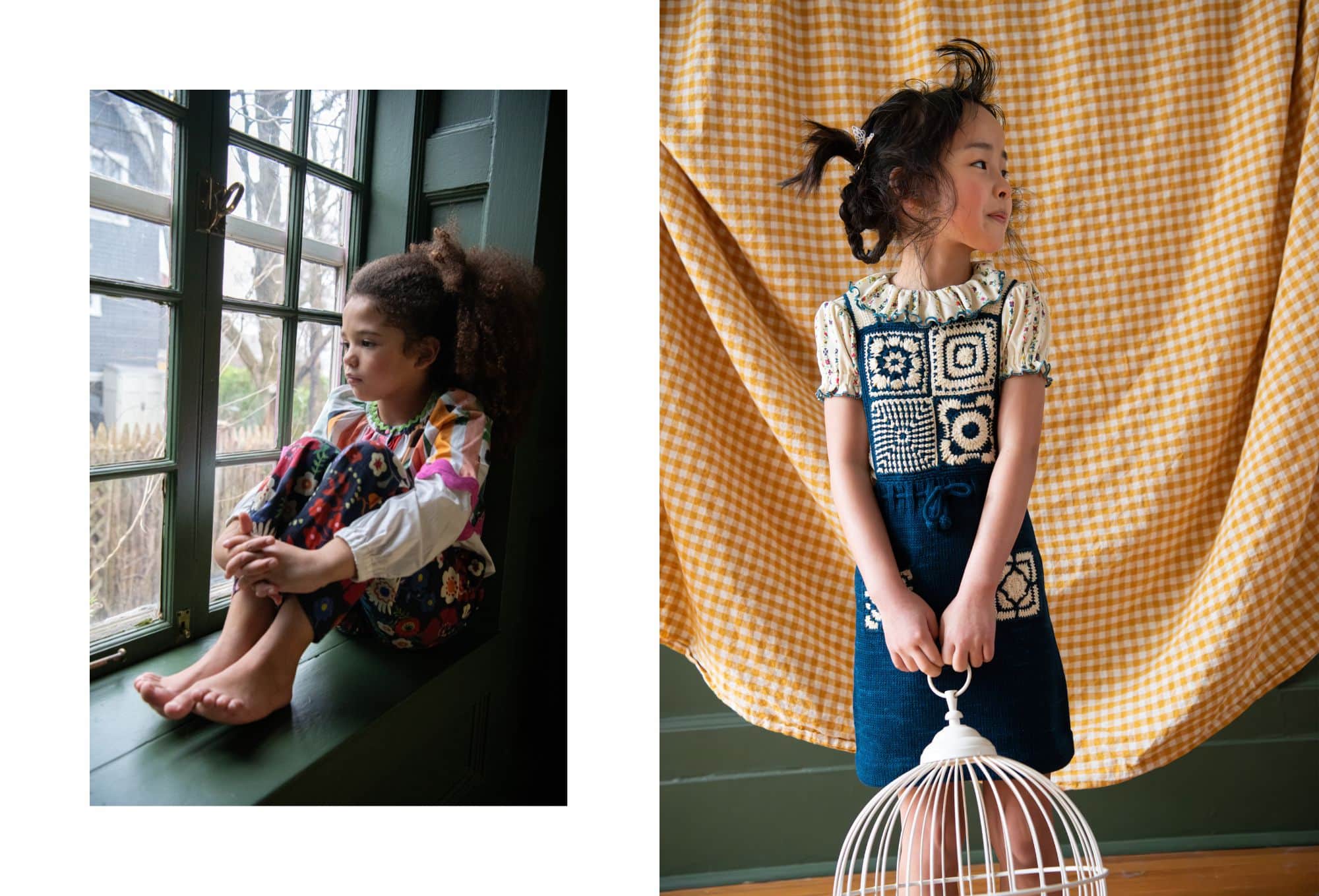 On the left, a young girl sits barefoot on a green windowsill, hugging her knees and gazing outside. She wears a vibrant outfit with floral pants and a multicolored striped top. On the right, another girl stands in front of a yellow gingham fabric backdrop, wearing a cream blouse with puffed sleeves and a navy blue crochet pinafore decorated with square patterns. She holds a white decorative birdcage and looks to the side with a playful expression. Photo by Sabrina Helas.