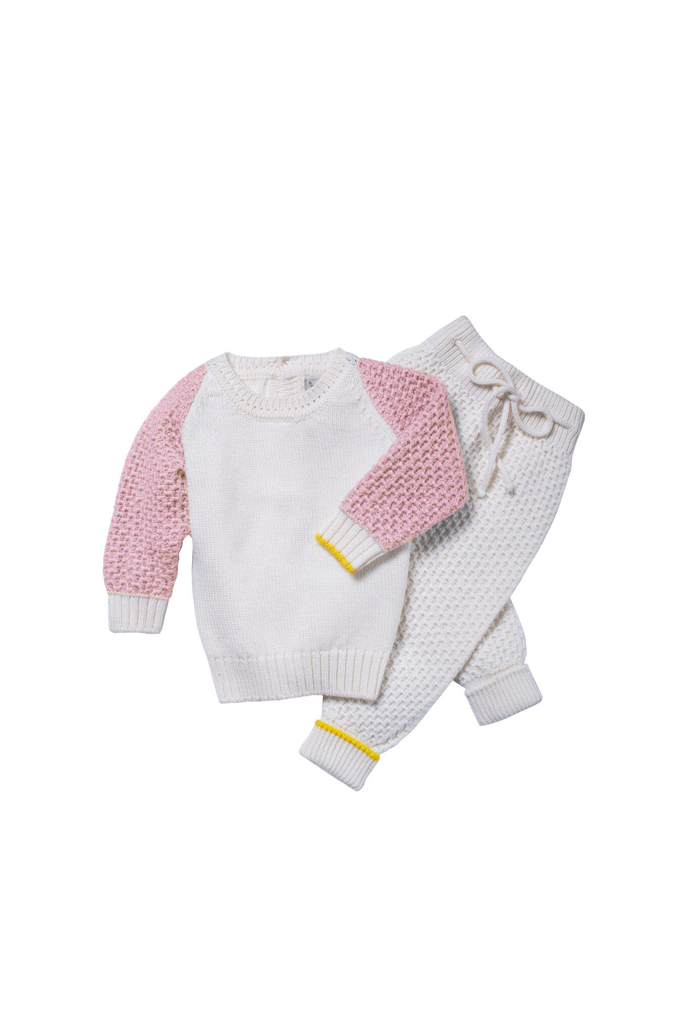 Cream knitted kids set with pink sleeves and drawstring pants from Gensami FW25.