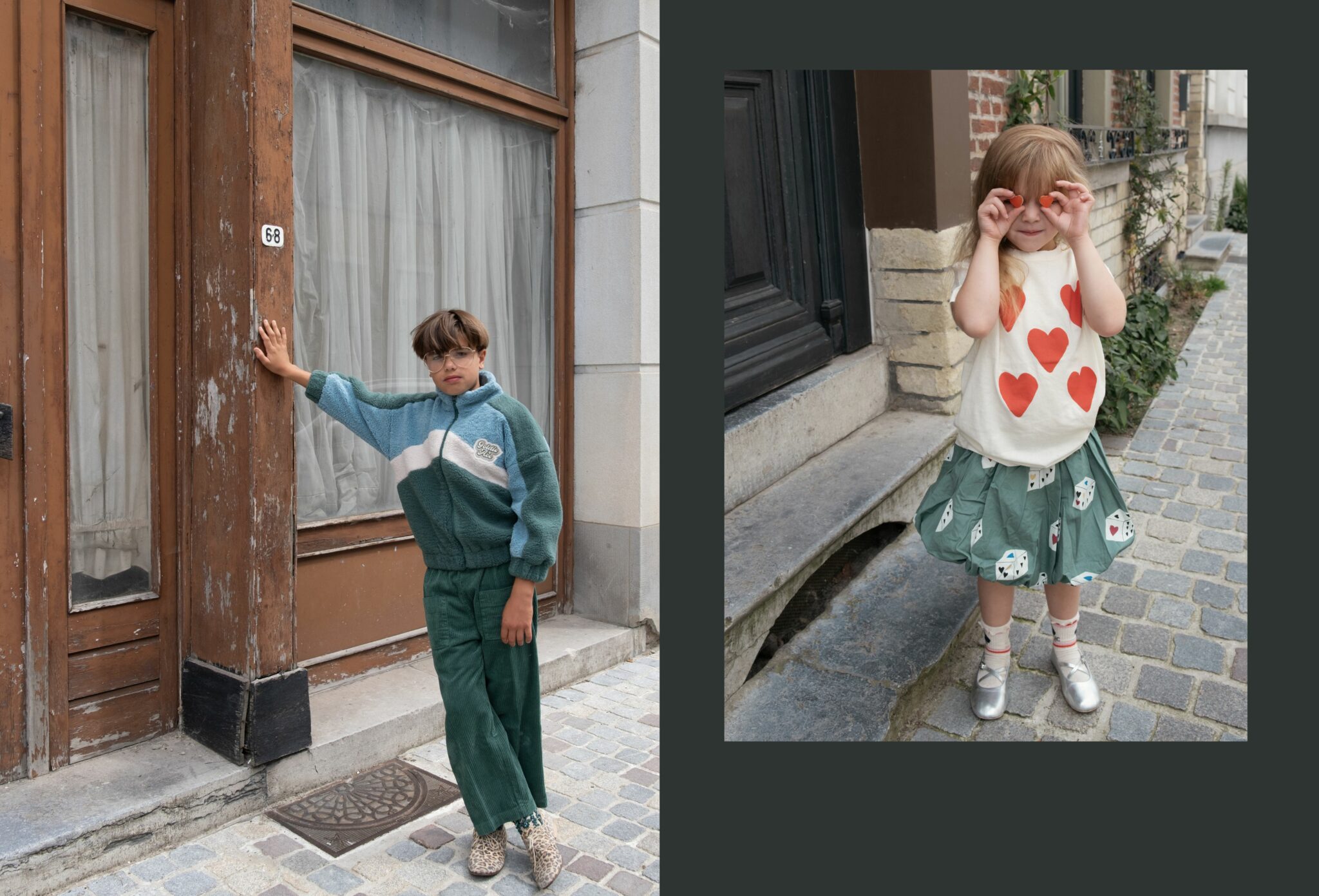 Lorenzo wearing GOLDIE & ACE FW25 color-block fleece jacket in teal and white, THE ANIMALS OBSERVATORY FW25 green corduroy pants and vintage shoes, standing against a rustic wooden doorway. Next to him, Luisa wearing THE ANIMALS OBSERVATORY FW25 white t-shirt with red heart prints, JELLY MALLOW FW25 green skirt with dice pattern, BOBO CHOSES FW25 socks and stylist’s own silver shoes, playfully holding heart shapes in front of her eyes on a cobblestone street. Fashion editorial 