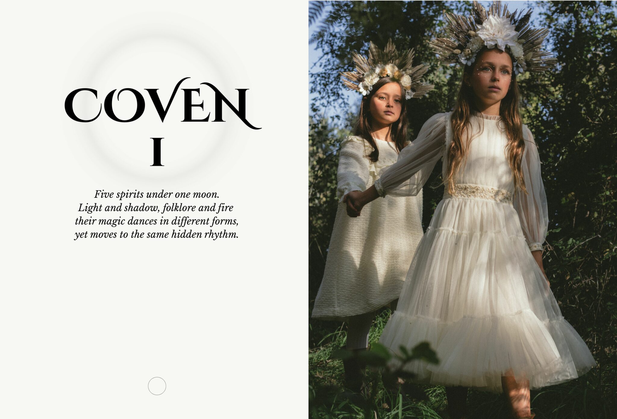 Two girls wearing white dresses and floral crowns walk hand in hand through a forest at golden hour. Kids fashion editorial COVEN I photographed by Lara Lutz for Scimparello Magazine.