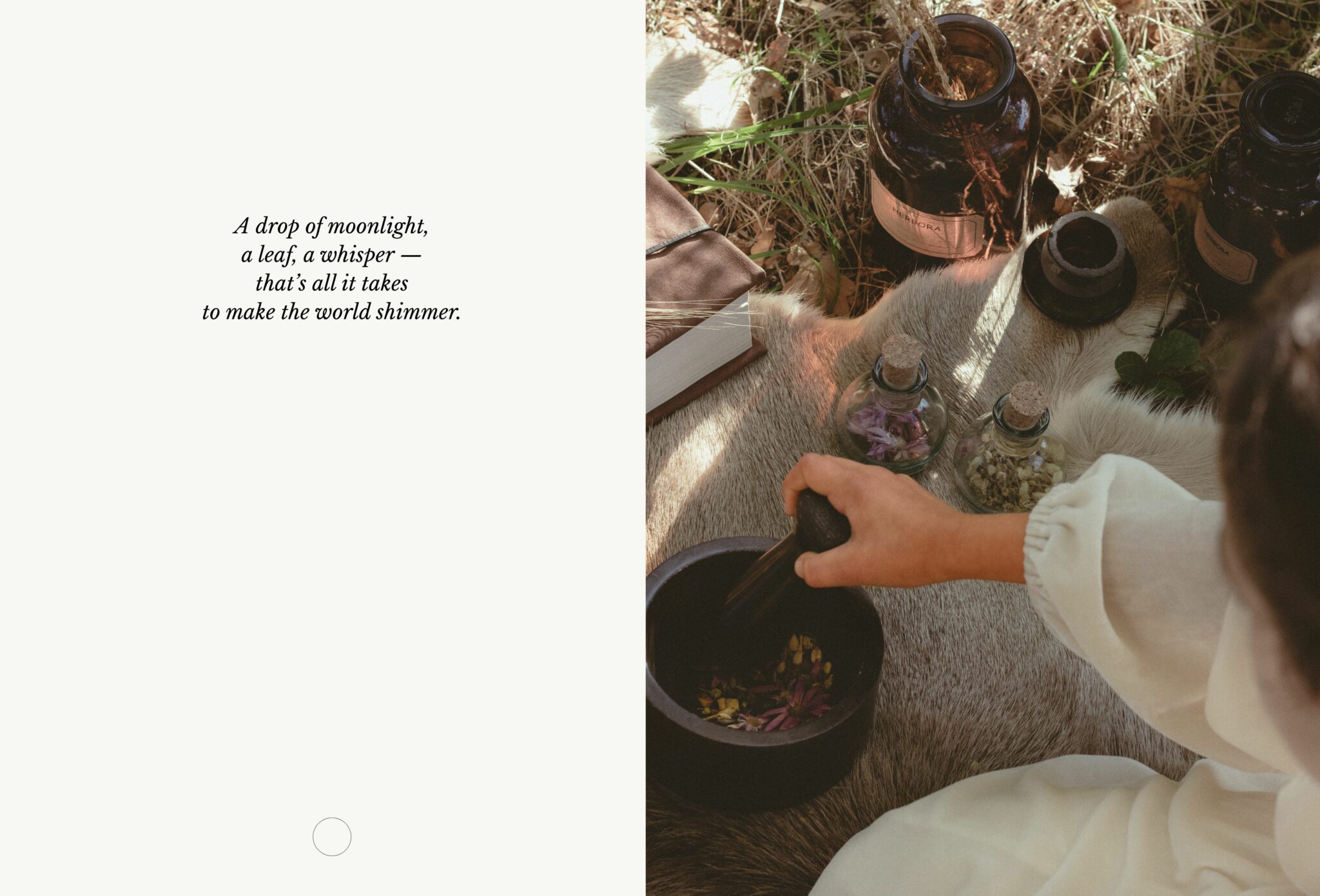 Child wearing a cream dress grinds herbs and petals in a mortar beside vintage glass bottles and spell jars on fur. Kids fashion editorial COVEN I by Lara Lutz for Scimparello Magazine, inspired by Halloween magic and moonlight rituals.