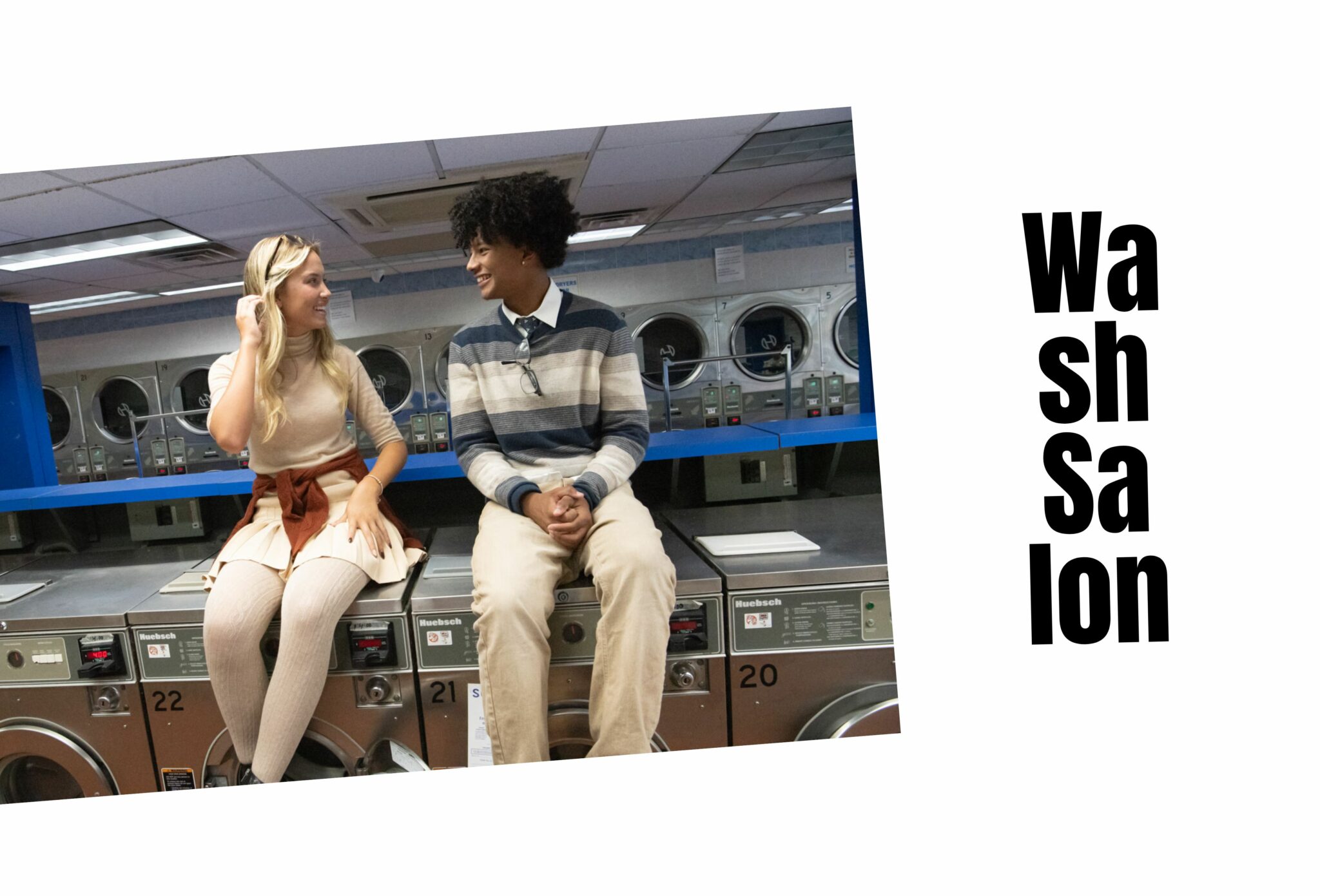 Teen girl and boy sitting on top of washing machines in a laundromat, smiling and talking. She wears a beige turtleneck top, pleated skirt, and cable-knit tights, while he wears a striped sweater over a collared shirt with beige trousers. Teen fashion editorial All the Time in the World by Sabrina Helas for Scimparello Magazine FW25.