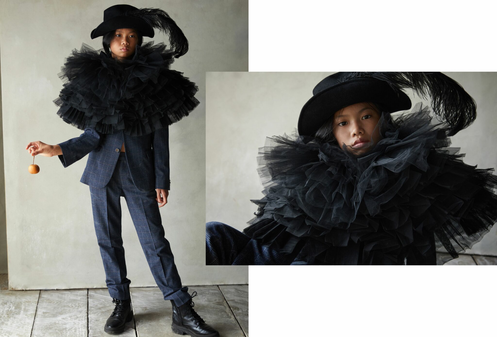 Fashion editorial That’s Bonkers for Scimparello Magazine FW25, photographed by Cleo Sullivan. A girl stands in a check suit APPAMAN FW25, wearing a voluminous layered black tulle collar made from REPETTO and BLOCH tutus FW25, a feathered hat BORSALINO FW25, and black boots DR. MARTENS FW25. The look mixes dandy tailoring with theatrical couture in a dramatic monochrome palette.