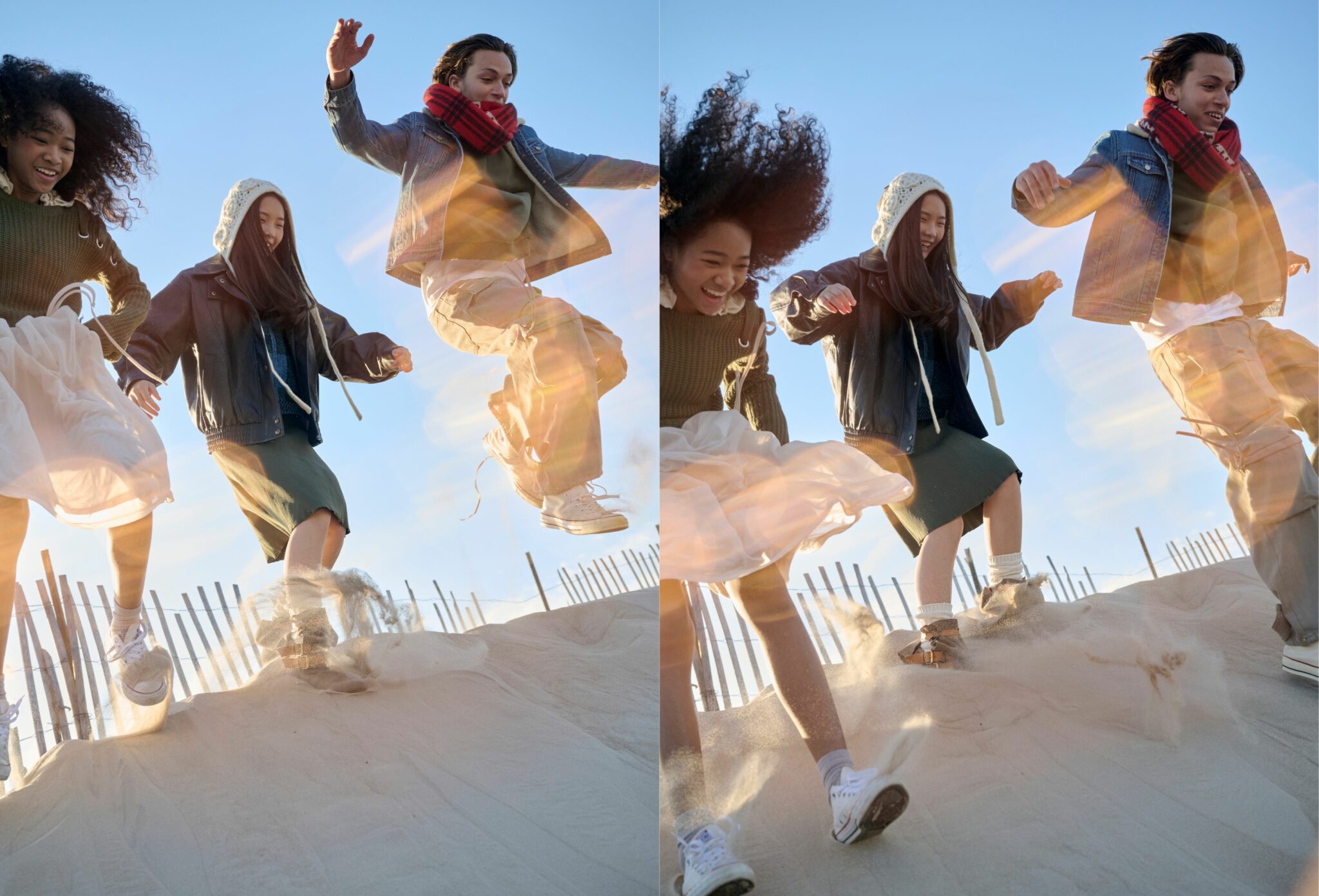 Split image of three teens running and jumping down sandy dunes in bright sunlight. They laugh as they move, kicking up sand with each step. One girl wears a green knit dress and white skirt, another wears a bonnet-style knit hat and dark jacket, and the boy wears a denim jacket, beige trousers, and a red checked scarf. Golden lens flares and a clear blue sky add an energetic, playful mood. Photo by Jay Fenwick, editorial published in Scimparello Magazine.