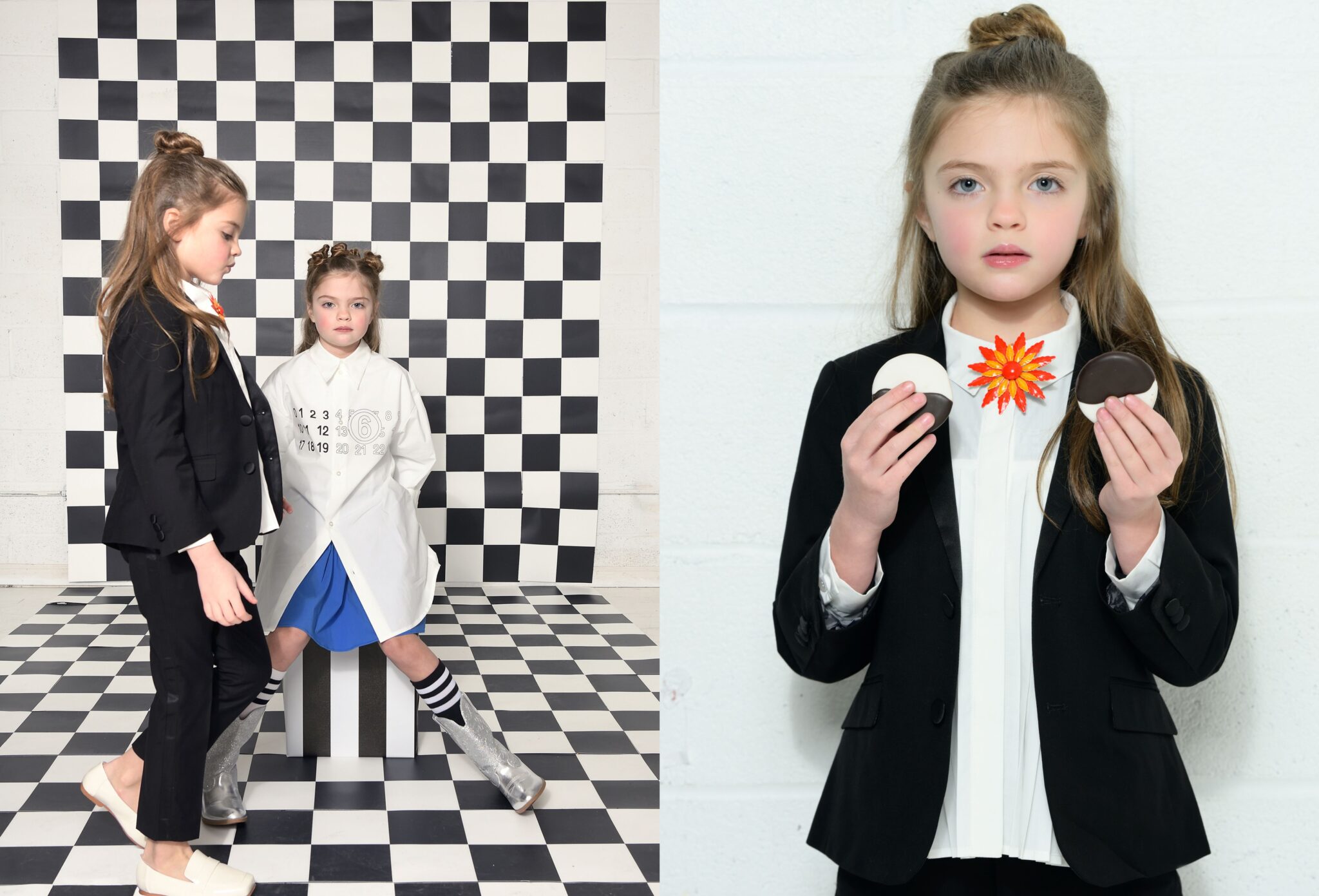 Two girls styled in contrasting looks on a black-and-white checkerboard set, one in a tailored black suit and the other in an oversized white shirt with blue skirt and striped socks, paired with a close-up portrait of a girl in a black blazer and white blouse holding two-tone cookies with a bold floral collar detail, kids fashion editorial SS26 Opposites Attract by David Butterman for Scimparello Magazine