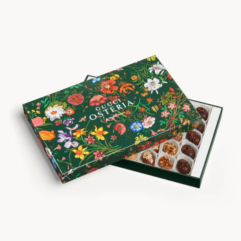 Gucci Osteria Easter chocolate egg presented in a green Gucci Flora patterned box with floral motifs and ribbon handle
