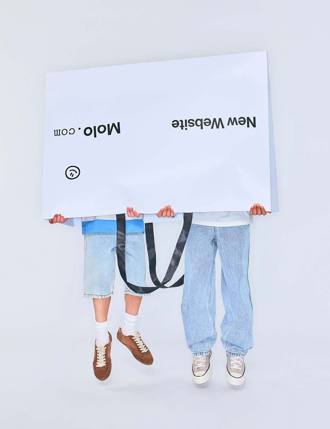 two kids with a paperbag