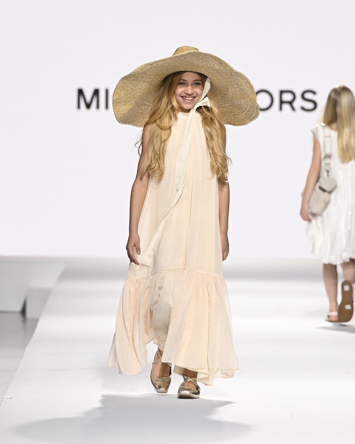 A model wearing an original creation from the Kids Around fashion Show