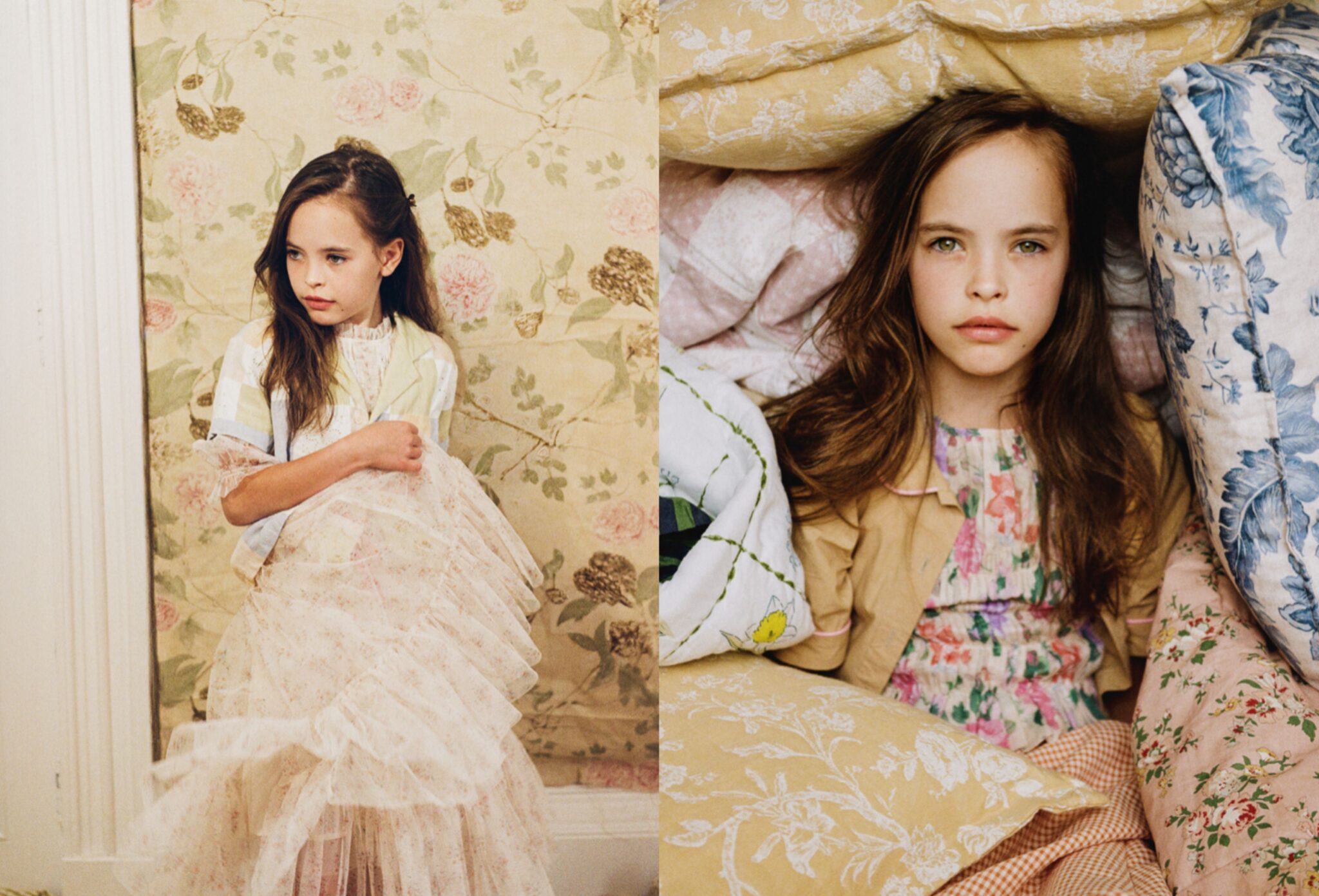 Girl in layered floral kids fashion looks appears across a double-page spread, sitting against vintage wallpaper and lying among patterned pillows and heirloom textiles for Scimparello Magazine editorial Printed Heirlooms by Emma Wright.