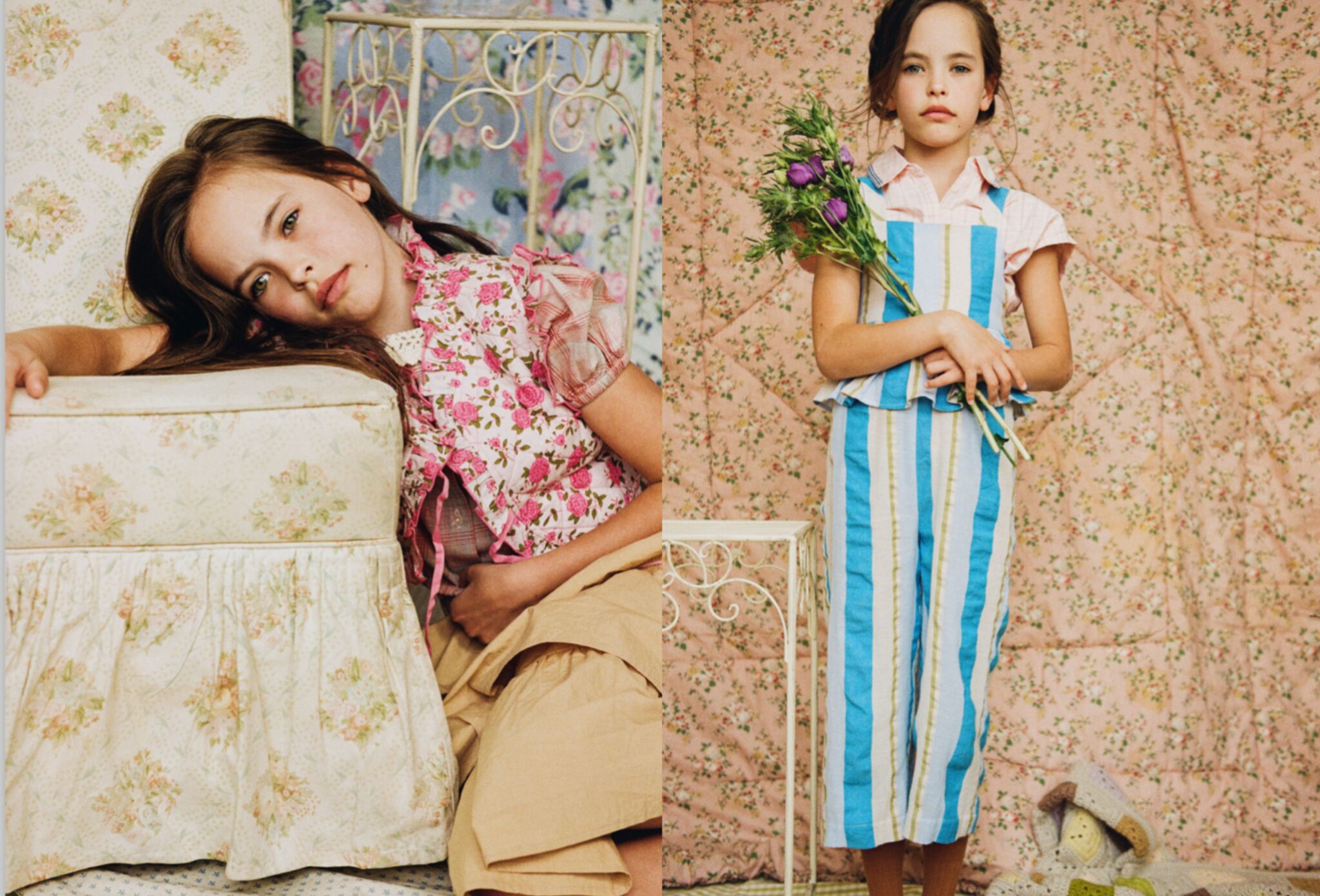 Girl in layered floral kids fashion looks appears across a double-page spread, resting beside a vintage floral armchair and holding purple flowers in a blue striped outfit for Scimparello Magazine editorial Printed Heirlooms by Emma Wright.