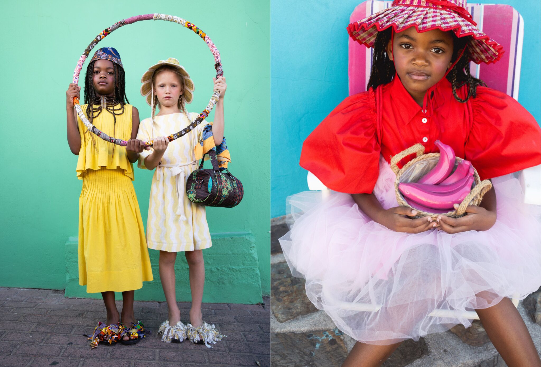 Two child models in yellow dresses holding a decorated hoop against a green wall, alongside a girl in a bold red top and tulle skirt holding a basket of colorful fruit, playful mix of textures and vibrant styling, kids fashion editorial Culture Clash by Hannah Mentz shot in South Africa for Scimparello Magazine