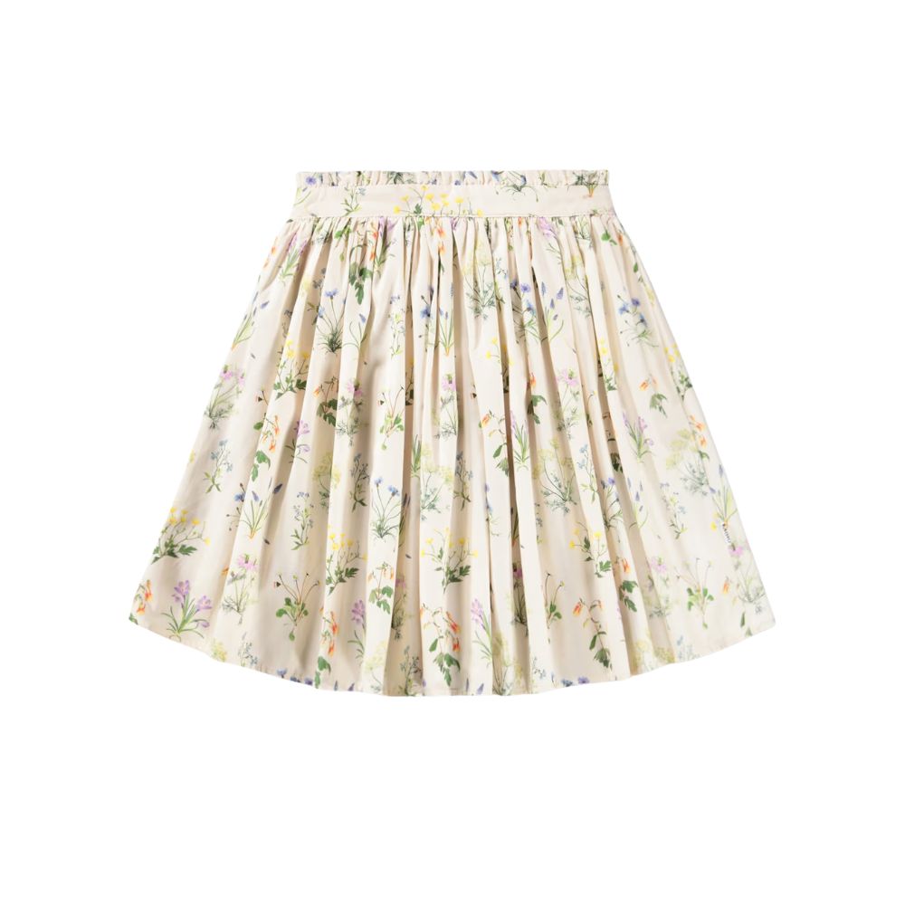 Cream floral skirt with soft pleats and delicate meadow print by Molo, styled for a Shop Floral Skirts selection by Scimparello Magazine.