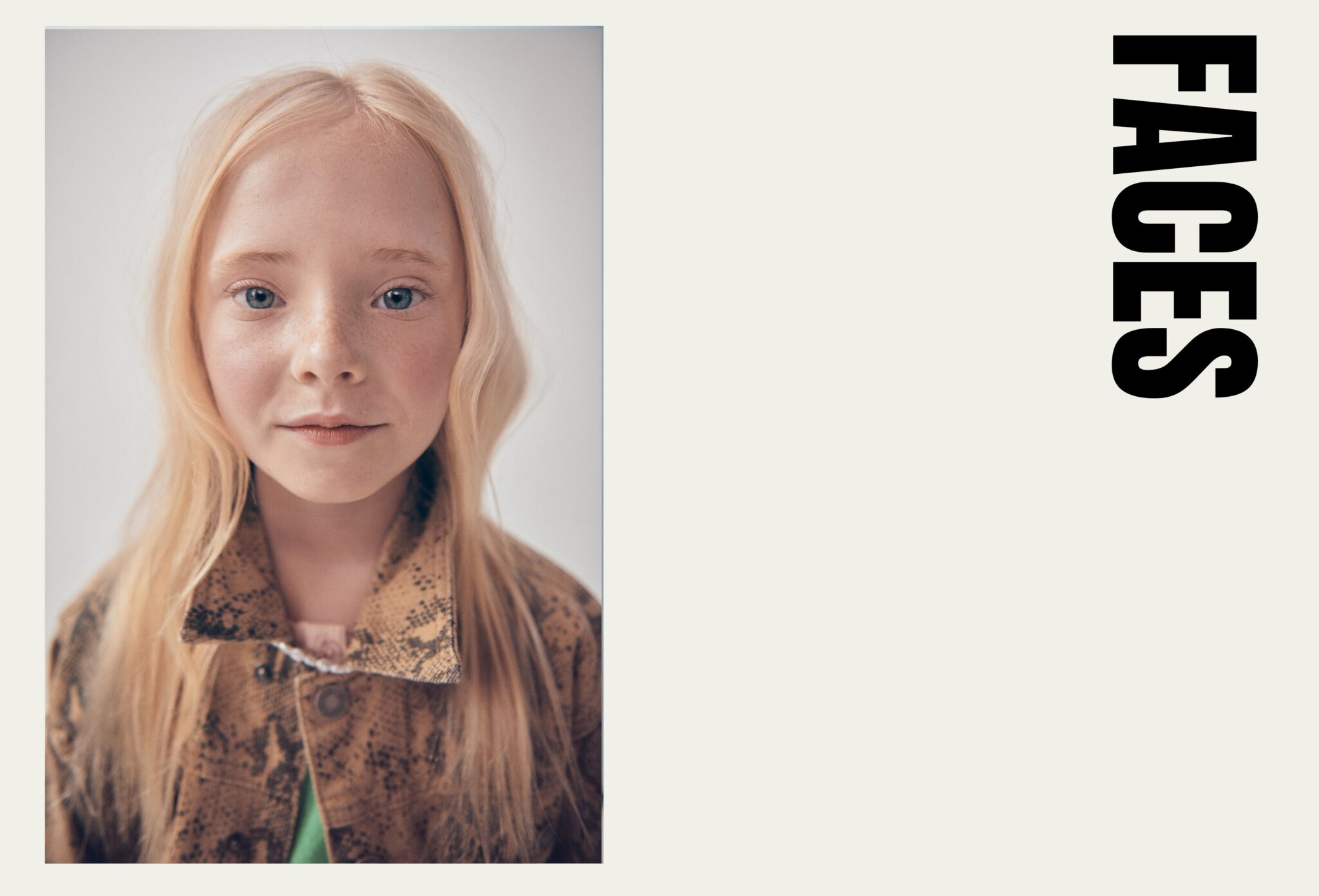 Close-up portrait of a blonde child with blue eyes wearing a patterned jacket in Faces, a kids fashion editorial photographed by Franck Malthierry for Scimparello Magazine.