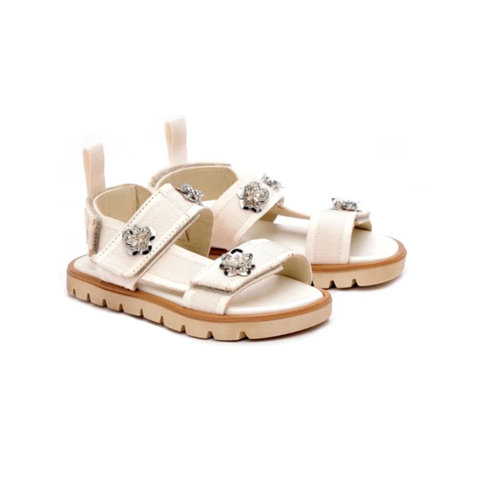 White strappy sandals with crystal flower details, styled for a Shop Floral Skirts selection by Scimparello Magazine.