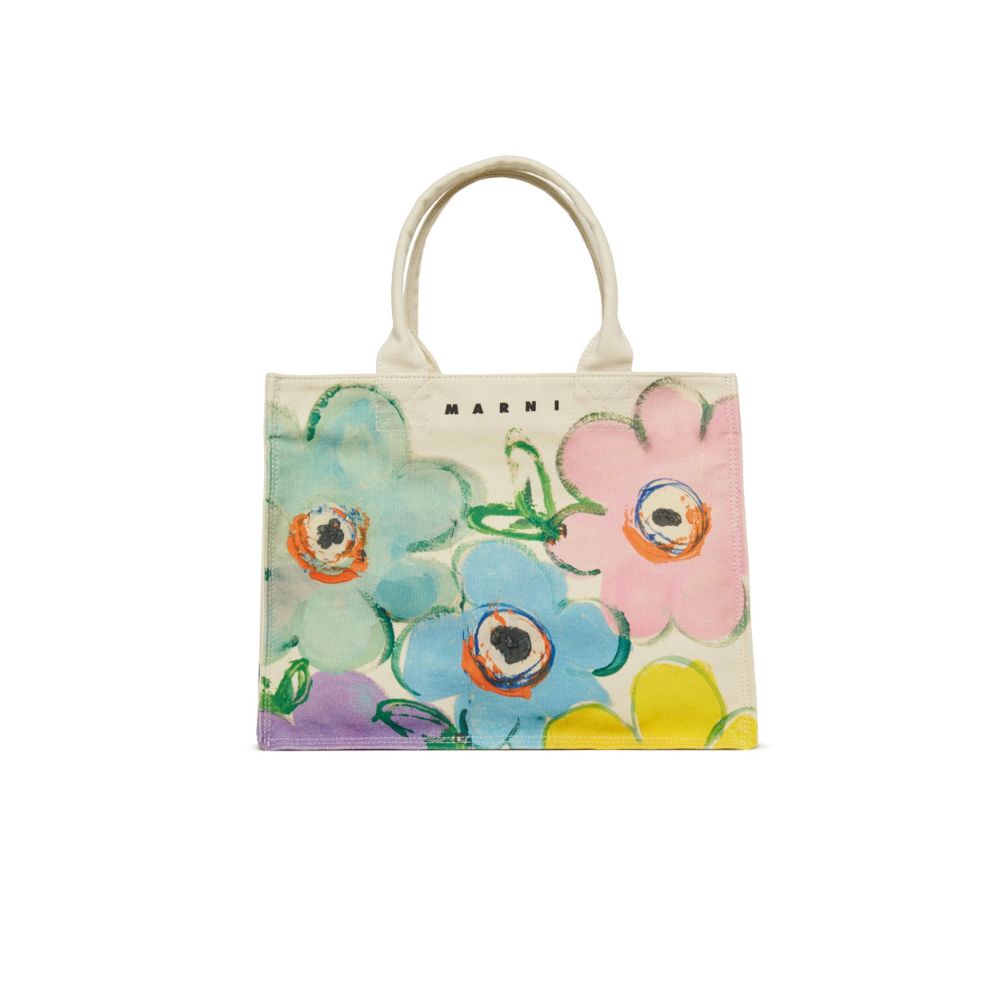 Marni kids floral handbag with pastel painted flowers on a white background, featured in Scimparello Magazine’s shop floral skirts styling selection.