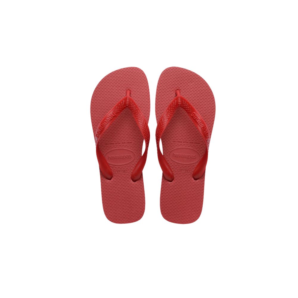 Red Havaianas flip-flops on a white background, featured in Scimparello Magazine’s shop floral skirts styling selection.