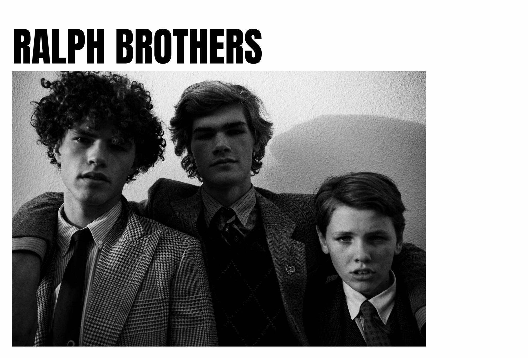 Black and white portrait of three brothers wearing classic Ralph Lauren tailored looks in Ralph Brothers, a kids fashion editorial photographed by Tim Marsella for Scimparello Magazine.