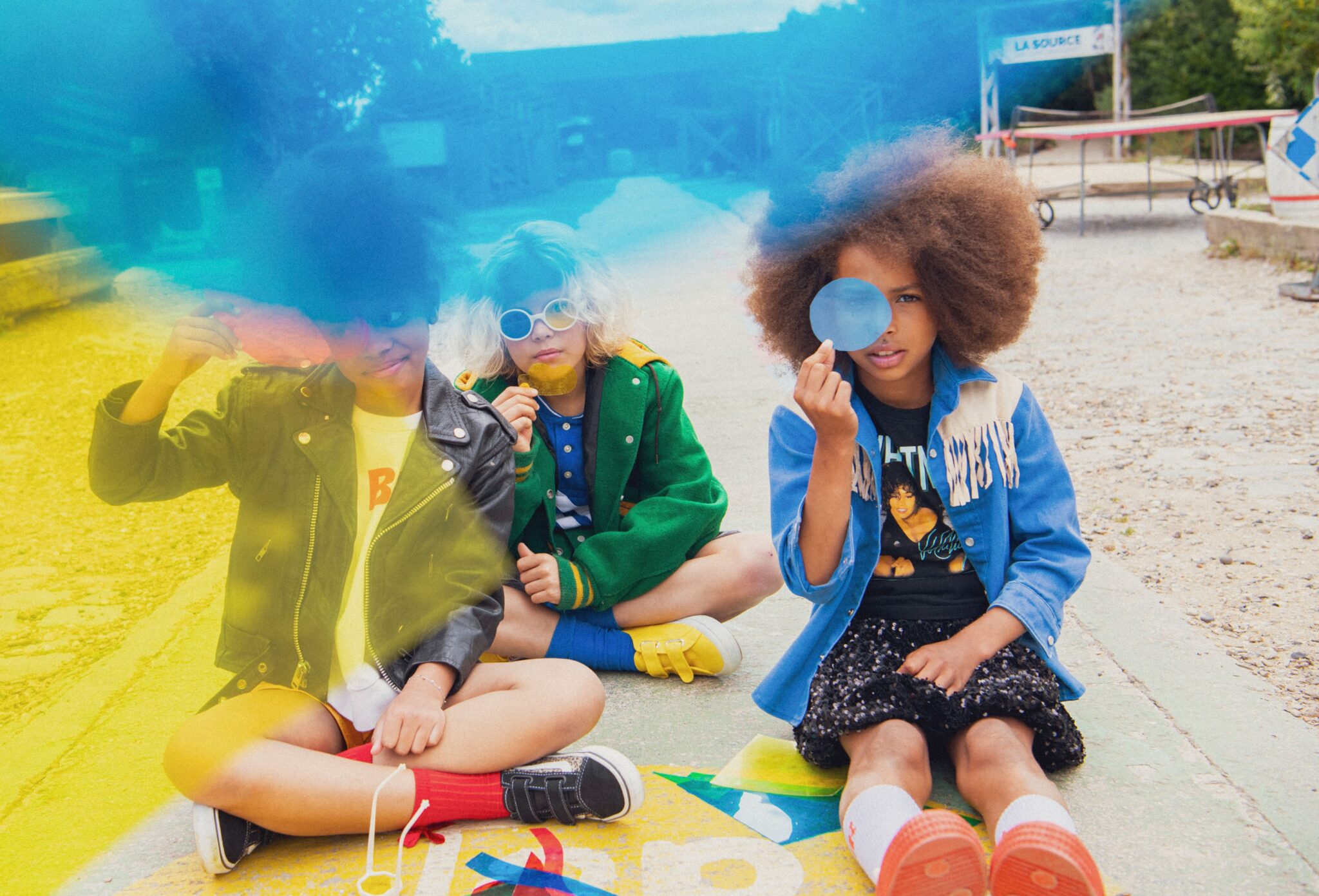 Kids fashion editorial RE.Twist photographed by Emmanuelle Lhote, featuring children in bold upcycled looks with colourful layers, graphic shapes and playful styling by Anne-Charlotte Le Grand for Scimparello Magazine.