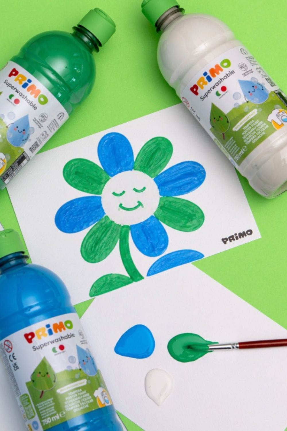 PRIMO Superwashable tempera paints alongside children's flower artwork, showcasing vibrant, washable colors for creative activities, arts and crafts, and imaginative play.
