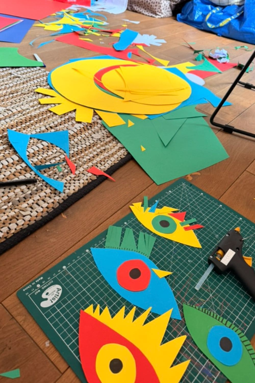 Colourful paper cut-outs and craft materials used for RE.Twist by Anne-Charlotte Le Grand, a creative upcycling project for childrenswear exploring patches, shapes and playful transformation for Scimparello Magazine.
