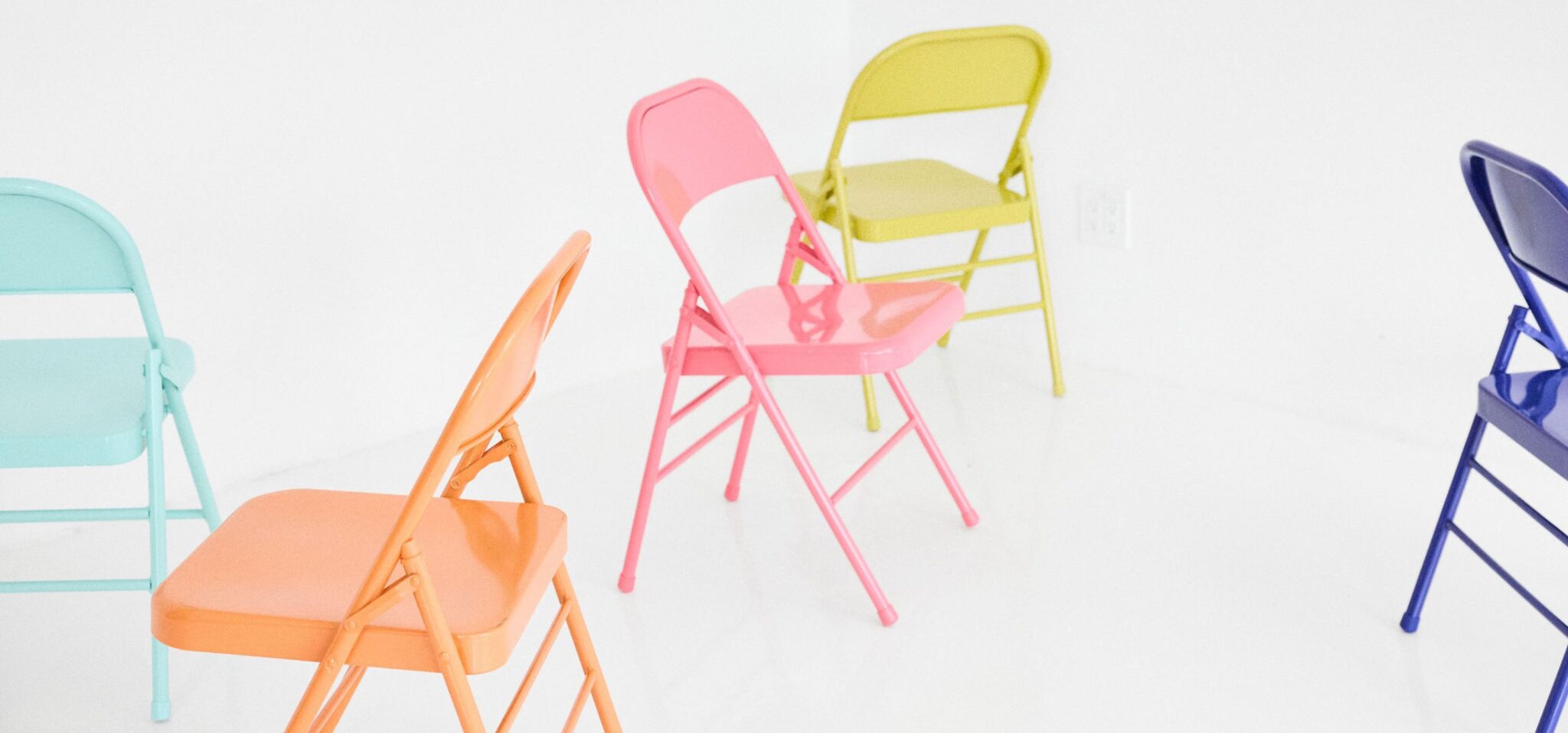 Kids fashion editorial The Chairs Volume Two photographed by Colleen Chrzanowski and styled by Maria Montane, featuring colourful chairs in a white studio setting for Scimparello Magazine.