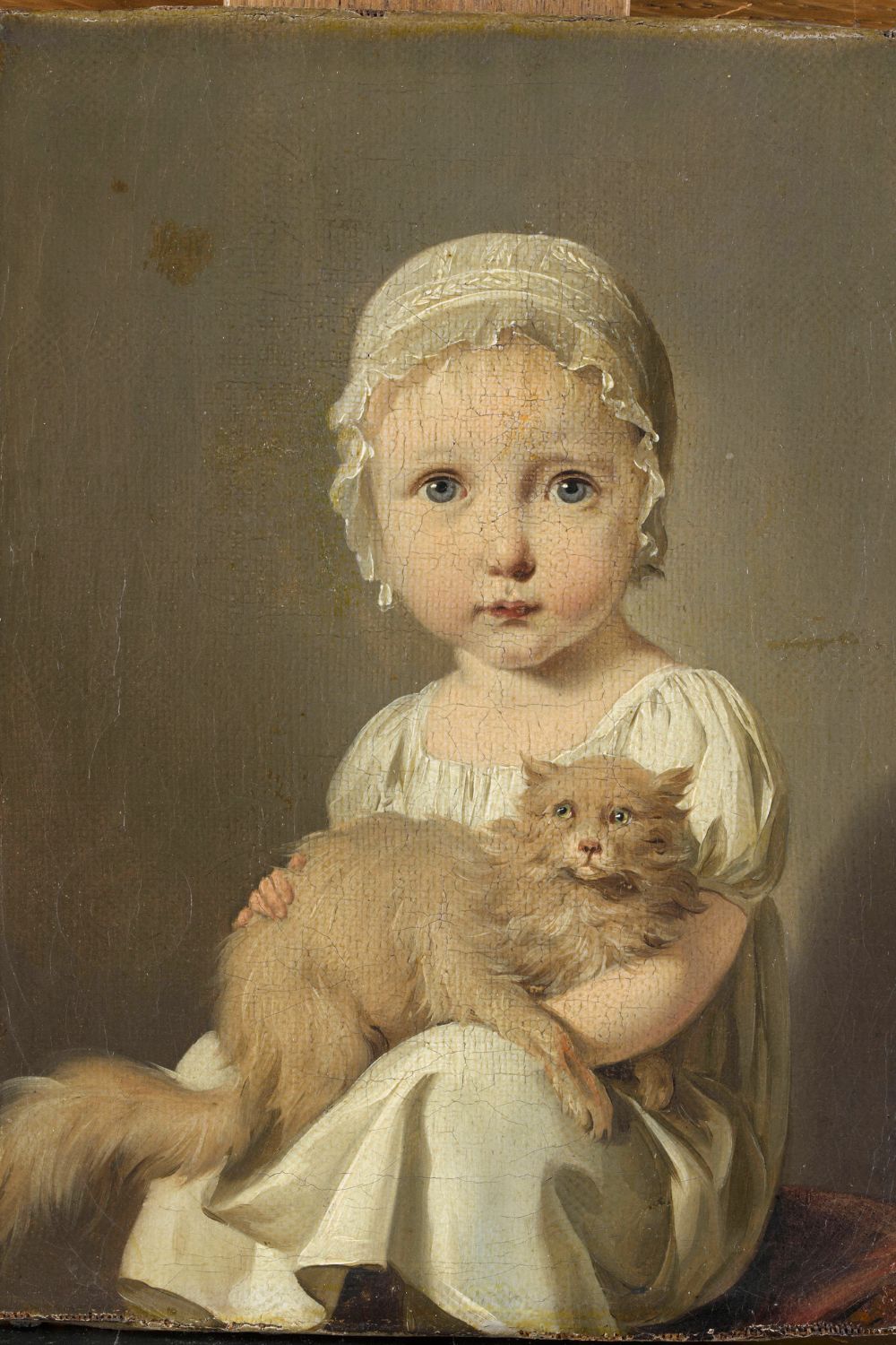 Louis-Léopold Boilly’s portrait of Gabrielle Arnault, a young girl in a white dress holding a fluffy cat on her lap.