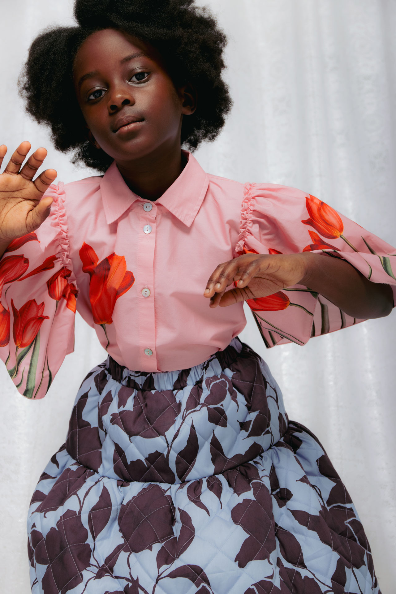 Christina Rohde AW26 pink blouse with oversized red tulip prints and blue floral quilted skirt