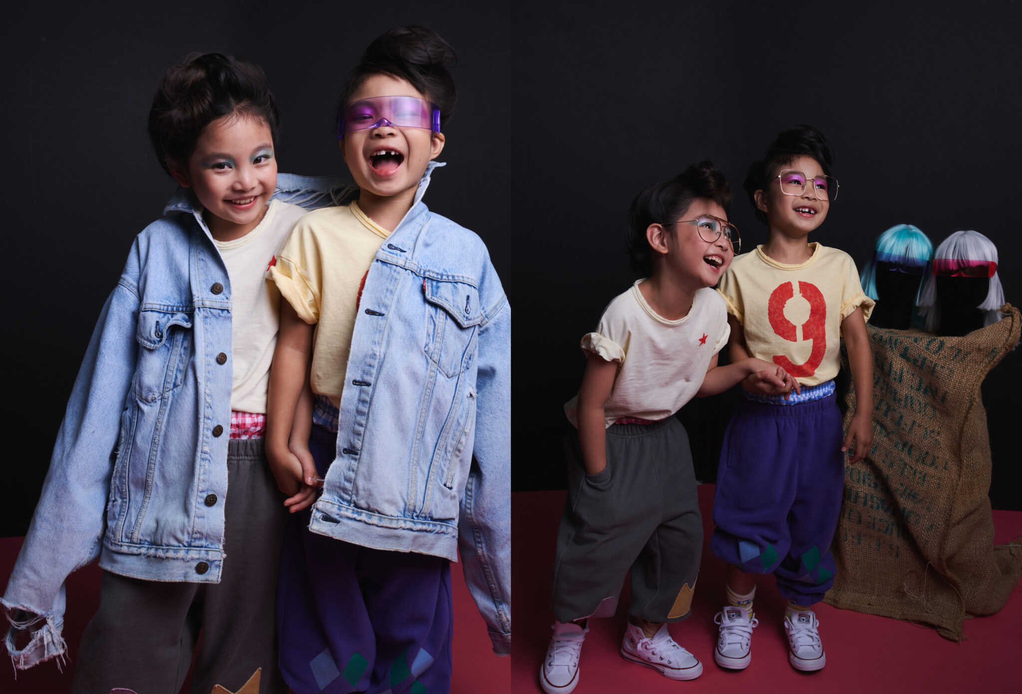 Two girls laughing in oversized vintage denim jackets, and the girls laughing next to two wigs on mannequin heads